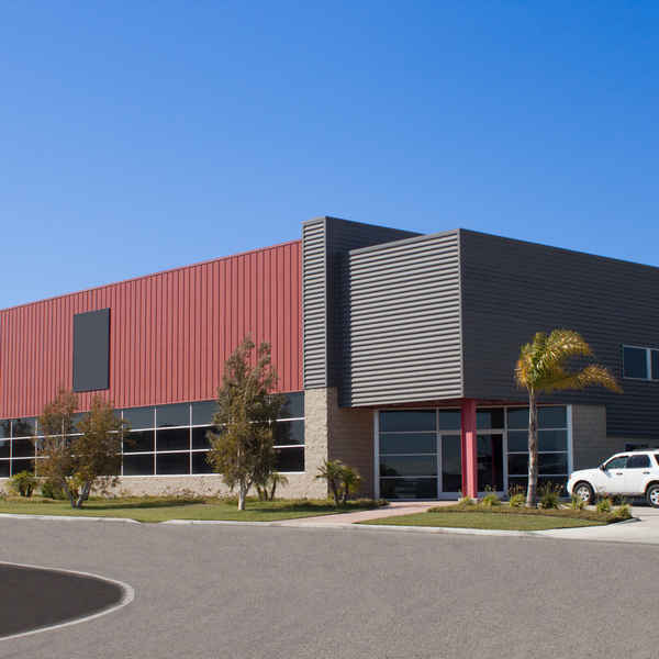 PUIRI pressure washes commercial building exteriors.