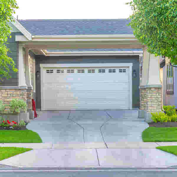 Driveways pressure washed by PUIRI increase your home's curb appeal.